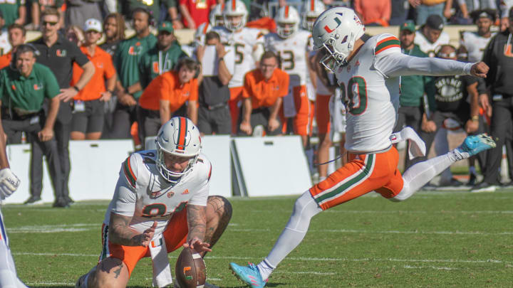 Miami Hurricanes place kicker Andres Borregales (30) against the Virginia Cavaliers  at Scott Stadium. 