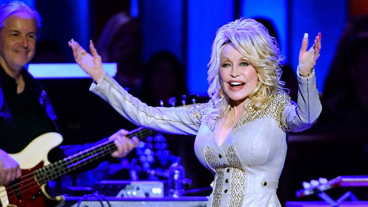Dolly Parton walks on stage during her 50th Grand Ole Opry member anniversary celebration at the Opry House on Oct. 12, 2019.