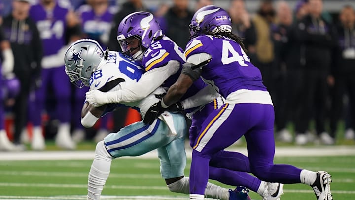 Dec 14, 2025; Arlington, Texas, USA; Minnesota Vikings linebacker Eric Wilson (55) and Minnesota Vikings safety Joshua Metellus (44) tackle Dallas Cowboys wide receiver Ceedee Lamb (88) during the first half at AT&T Stadium. Dec 14, 2025; Arlington, Texas, USA; Minnesota Vikings linebacker Eric Wilson (55) and Minnesota Vikings safety Joshua Metellus (44) tackle Dallas Cowboys wide receiver Ceedee Lamb (88) during the first half at AT&T Stadium.