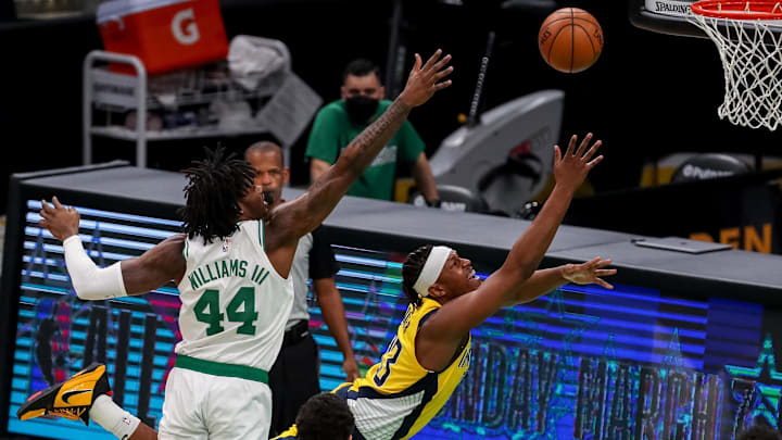 Feb 26, 2021; Boston, Massachusetts, USA; Indiana Pacers center Myles Turner (33) shoots against Boston Celtics center Robert Williams III (44) during the first half at TD Garden. Mandatory Credit: Paul Rutherford-Imagn Images
