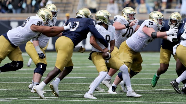 Notre Dame defender Bryce Young (30) knocks out the ball from quarterback Kenny Minchey (8) Saturday, April 20, 2024, at the annual Notre Dame Blue-Gold spring football game at Notre Dame Stadium in South Bend.