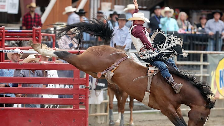 Bareback rider Mason Clements, of Spanish Fork, Utah, rides a bucking horse named Bruno Mars during the opening night of the Kitsap Fair & Stampede rodeo on in Bremerton, Wash. on Wednesday, Aug. 23, 2023.