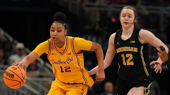 Mar 8, 2025; Indianapolis, IN, USA; South California Trojans guard JuJu Watkins (12) dribbles the ball against Michigan Wolverines guard Syla Swords (12) during the Big Ten Conference Tournament semifinals at Gainbridge Fieldhouse. Mandatory Credit: Stephanie Amador Blondet-Imagn Images