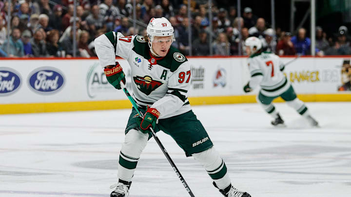 Apr 9, 2024; Denver, Colorado, USA; Minnesota Wild left wing Kirill Kaprizov (97) controls the puck in the first period against the Colorado Avalanche at Ball Arena. Mandatory Credit: Isaiah J. Downing-Imagn Images