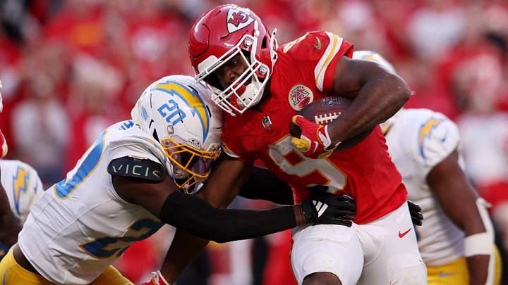 Oct 18, 2026; Kansas City, Missouri, USA;  Kansas City Chiefs running back Kenneth Walker III (9) rushes as Los Angeles Chargers cornerback Cam Hart (20) tackles during the fourth quarter at GEHA Field at Arrowhead Stadium.  Mandatory Credit: William Purnell-Imagn Images