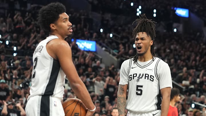Apr 28, 2026; San Antonio, Texas, USA; San Antonio Spurs guard Stephon Castle (5) reacts after guard Dylan Harper (2) scored during the first half of game five of the first round of the 2026 NBA Playoffs against the Portland Trail Blazers at Frost Bank Center. Mandatory Credit: Scott Wachter-Imagn Images