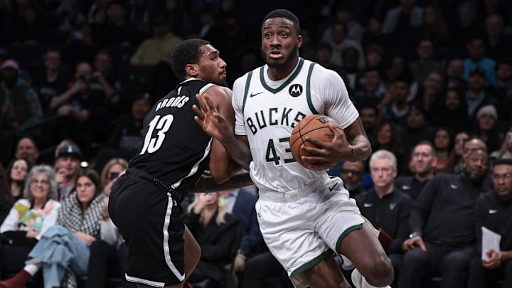 Dec 27, 2023; Brooklyn, New York, USA; Milwaukee Bucks forward Thanasis Antetokounmpo (43) drives to the basket against Brooklyn Nets guard Armoni Brooks (13) during the second half at Barclays Center. Mandatory Credit: Vincent Carchietta-Imagn Images