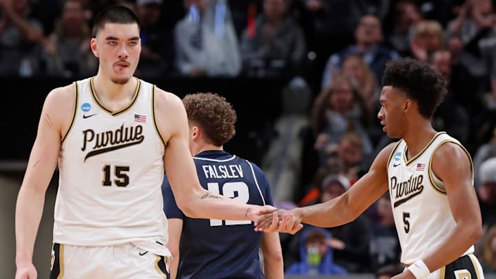 Purdue Boilermakers center Zach Edey (15) high-fives Purdue Boilermakers guard Myles Colvin (5)