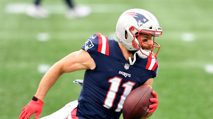 Oct 25, 2020; Foxborough, Massachusetts, USA; New England Patriots wide receiver Julian Edelman (11) runs with the ball during warmups before a game against the San Francisco 49ers at Gillette Stadium. Mandatory Credit: Brian Fluharty-Imagn Images