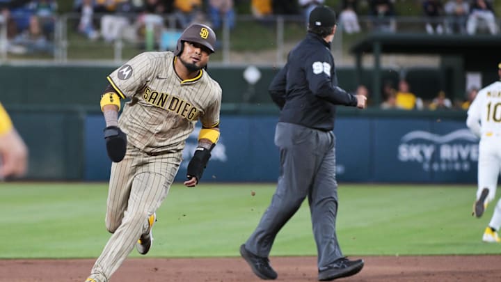 Apr 7, 2025; West Sacramento, California, USA; San Diego Padres first base Luis Arraez (4) rounds second base on his way to third during the third inning of the game against the Athletics at Sutter Health Park. Mandatory Credit: Ed Szczepanski-Imagn Images Apr 7, 2025; West Sacramento, California, USA; San Diego Padres first base Luis Arraez (4) rounds second base on his way to third during the third inning of the game against the Athletics at Sutter Health Park. Mandatory Credit: Ed Szczepanski-Imagn Images