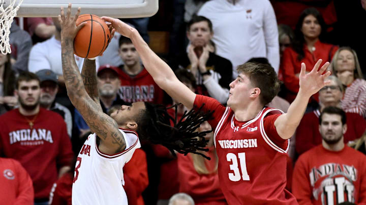 Feb 7, 2026; Bloomington, Indiana, USA; Wisconsin Badgers forward Nolan Winter (31) blocks Indiana Hoosiers guard Lamar Wilkerson (3) during the second half at Simon Skjodt Assembly Hall. Mandatory Credit: Robert Goddin-Imagn Images