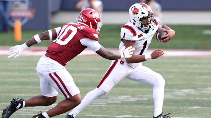 Sep 6, 2025; Little Rock, Arkansas, USA; Arkansas State Red Wolves quarterback Jaylen Raynor (1) rushes during the first quarter against the Arkansas Razorbacks at War Memorial Stadium.