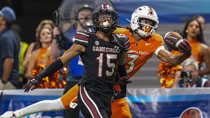 Aug 31, 2025; Atlanta, Georgia, USA; Virginia Tech Hokies wide receiver Donavon Greene (3) tries to make a one handed catch behind South Carolina Gamecocks defensive back Brandon Cisse (15) during the second half at Mercedes-Benz Stadium. Mandatory Credit: Dale Zanine-Imagn Images