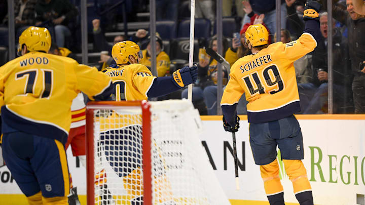 Dec 2, 2025; Nashville, Tennessee, USA; Nashville Predators left wing Reid Schaefer (49) celebrates his goal against the Calgary Flames during the first period at Bridgestone Arena. Mandatory Credit: Steve Roberts-Imagn Images Dec 2, 2025; Nashville, Tennessee, USA; Nashville Predators left wing Reid Schaefer (49) celebrates his goal against the Calgary Flames during the first period at Bridgestone Arena. Mandatory Credit: Steve Roberts-Imagn Images