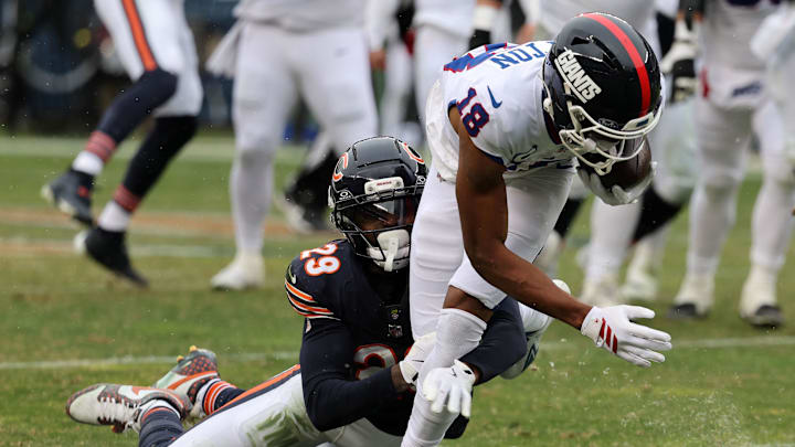 Nov 9, 2025; Chicago, Illinois, USA; New York Giants wide receiver Darius Slayton (18) makes a catch against Chicago Bears cornerback Tyrique Stevenson (29) during the second half at Soldier Field. Mandatory Credit: Mike Dinovo-Imagn Images