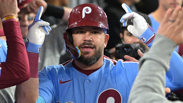Oct 8, 2025; Los Angeles, California, USA; Philadelphia Phillies designated hitter Kyle Schwarber (12) congratulated in the dugout after hitting a solo home run in the fourth inning against the Los Angeles Dodgers of game three of the NLDS during the 2025 MLB playoffs at Dodger Stadium. Mandatory Credit: Jayne Kamin-Oncea-Imagn Images