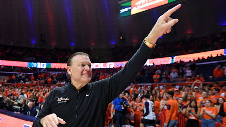 Nov 14, 2025; Champaign, Illinois, USA;  Illinois Fighting Illini head coach Brad Underwood greets the crowd before the tip of the game with the Colgate Raiders  at State Farm Center. Mandatory Credit: Ron Johnson-Imagn Images