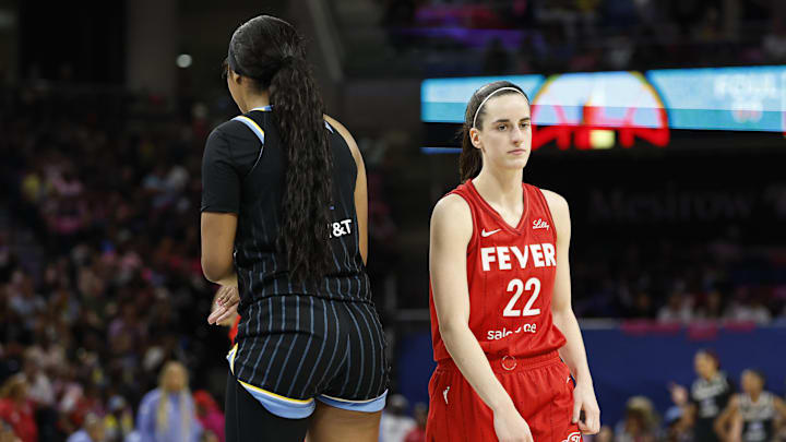 Aug 30, 2024; Chicago, Illinois, USA; Indiana Fever guard Caitlin Clark (22) walks by Chicago Sky forward Angel Reese (5) during the second half at Wintrust Arena. Mandatory Credit: Kamil Krzaczynski-Imagn Images