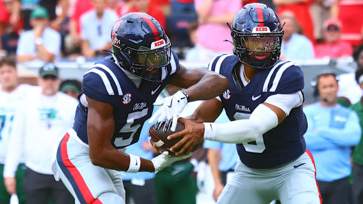 Sep 20, 2025; Oxford, Mississippi, USA; Mississippi Rebels quarterback Trinidad Chambliss (6) hands the ball off to running back Kewan Lacy (5) during the first quarter against the Tulane Green Wave at Vaught-Hemingway Stadium. Mandatory Credit: Petre Thomas-Imagn Images
