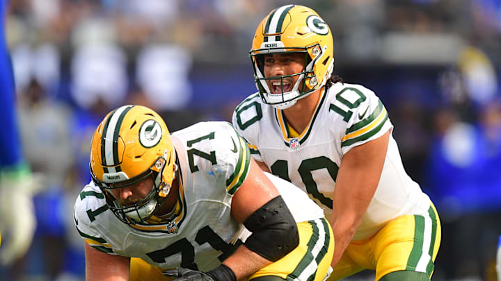 Oct 6, 2024; Inglewood, California, USA; Green Bay Packers quarterback Jordan Love (10) under center with center Josh Myers (71) against the Los Angeles Rams during the second half at SoFi Stadium. Mandatory Credit: Gary A. Vasquez-Imagn Images