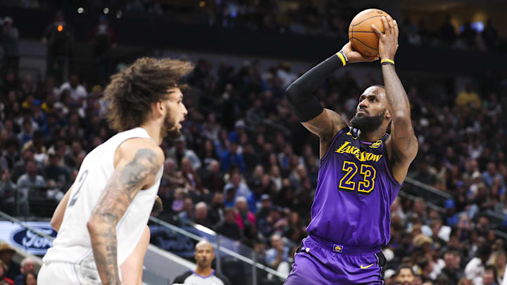 Jan 7, 2025; Dallas, Texas, USA; Los Angeles Lakers forward LeBron James (23) shoots over Dallas Mavericks center Dereck Lively II (2) during the second half at American Airlines Center. Mandatory Credit: Kevin Jairaj-Imagn Images