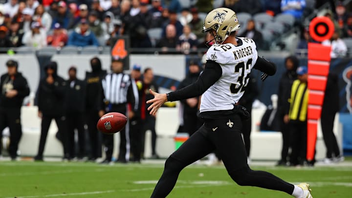 Oct 19, 2025; Chicago, Illinois, USA; New Orleans Saints punter Kai Kroeger (32) punts the ball to the Chicago Bears during the second half at Soldier Field. Mandatory Credit: Mike Dinovo-Imagn Images