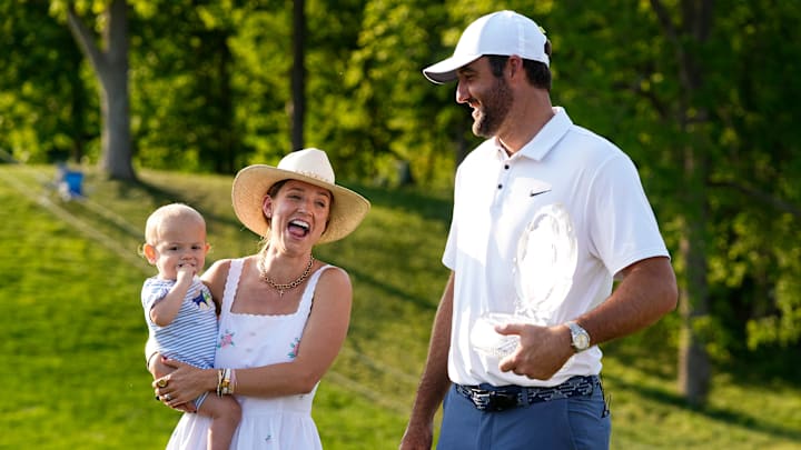 Scottie Scheffler celebrates with his wife, Meredith, and son, Bennett, after winning the Memorial Tournament at Muirfield Village Golf Club in Dublin following the final round on June 1, 2025.
