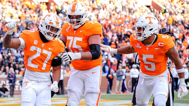Nov 23, 2024; Knoxville, Tennessee, USA; Tennessee Volunteers running back Peyton Lewis (27) celebrates with wide receiver Bru McCoy (5) and offensive lineman Jackson Lampley (75) after scoring a touchdown  against the UTEP Miners at Neyland Stadium. Mandatory Credit: Brianna Paciorka/USA TODAY Network via Imagn Images