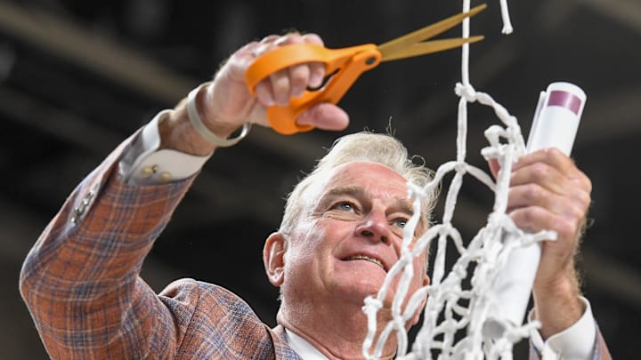 Texas Longhorns head coach Vic Schaefer cuts down the net Sunday, March 8, 2026, after the SEC Women's Basketball Tournament Championship game against the South Carolina Gamecocks at Bon Secours Wellness Arena in Greenville, South Carolina. Texas Longhorns won 78-61.