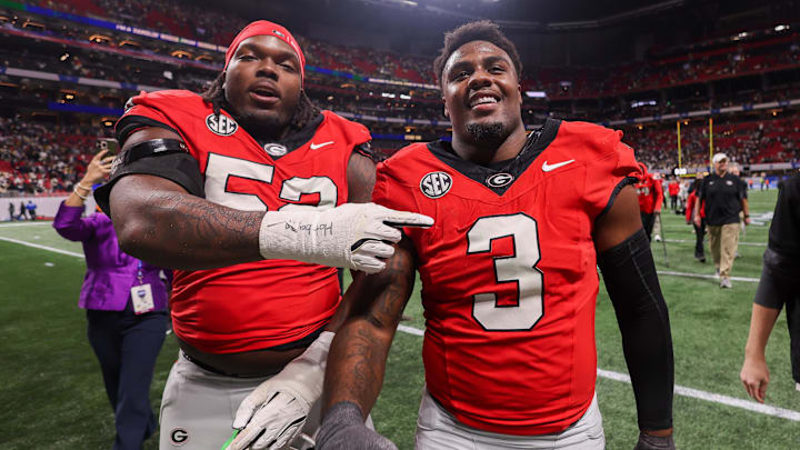 Nov 28, 2025; Atlanta, Georgia, USA; Georgia Bulldogs defensive lineman Christen Miller (52) and linebacker CJ Allen (3) celebrate after a victory over the Georgia Tech Yellow Jackets at Mercedes-Benz Stadium. Mandatory Credit: Brett Davis-Imagn Images
