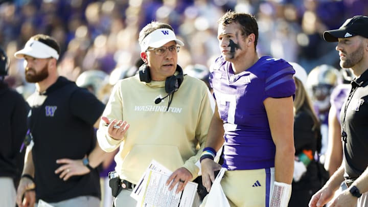 Sep 21, 2024; Seattle, Washington, USA; Washington Huskies head coach Jedd Fisch talks with quarterback Will Rogers (7) during the second quarter against the Northwestern Wildcats at Alaska Airlines Field at Husky Stadium. Mandatory Credit: Joe Nicholson-Imagn Images