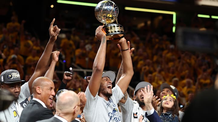 May 31, 2025; Indianapolis, Indiana, USA; Indiana Pacers center Myles Turner (33) raises the trophy after game six of the eastern conference finals against the New York Knicks for the 2025 NBA Playoffs at Gainbridge Fieldhouse. Mandatory Credit: Trevor Ruszkowski-Imagn Images