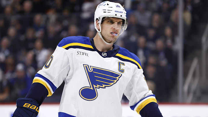 Apr 7, 2025; Winnipeg, Manitoba, CAN; St. Louis Blues center Brayden Schenn (10) looks on during a break in play against the Winnipeg Jets in the first period at Canada Life Centre. Mandatory Credit: James Carey Lauder-Imagn Images