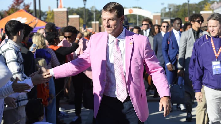 Oct 19, 2024; Clemson, South Carolina, USA; Clemson Tigers head coach Dabo Swinney, center, welcomes fans during Tiger Walk prior to the game against the Virginia Cavaliers at Memorial Stadium. 