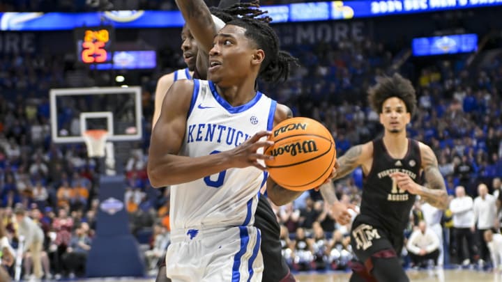 Mar 15, 2024; Nashville, TN, USA; Kentucky Wildcats guard Rob Dillingham (0) drives past Texas A&M Aggies guard Manny Obaseki (35) during the second half at Bridgestone Arena. Mandatory Credit: Steve Roberts-USA TODAY Sports Mar 15, 2024; Nashville, TN, USA; Kentucky Wildcats guard Rob Dillingham (0) drives past Texas A&M Aggies guard Manny Obaseki (35) during the second half at Bridgestone Arena. Mandatory Credit: Steve Roberts-USA TODAY Sports
