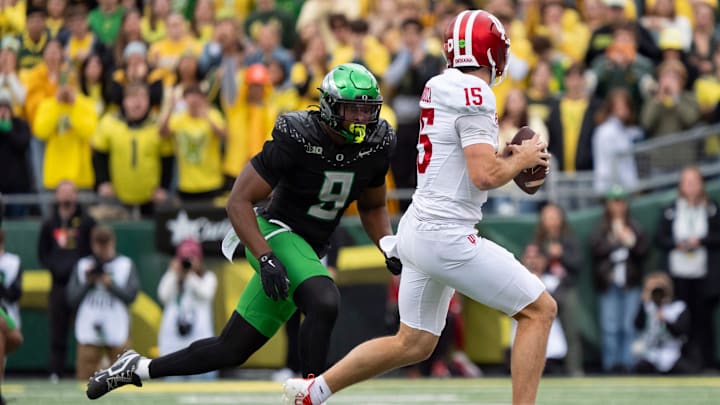 Oregon outside linebacker Blake Purchase pressures Indiana quarterback Fernando Mendoza as the Oregon Ducks host the Indiana Hoosiers Oct. 11, 2025, at Autzen Stadium in Eugene, Oregon.