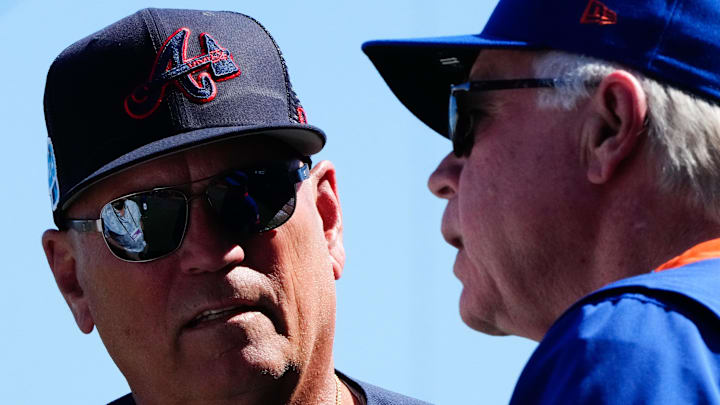 Mar 2, 2023; Port St. Lucie, Florida, USA; Atlanta Braves manger Brian Snitker talks to New York Mets manager Buck Showalter prior to a game between the New York Mets and the Atlanta Braves at Clover Park. Mandatory Credit: Rich Storry-Imagn Images