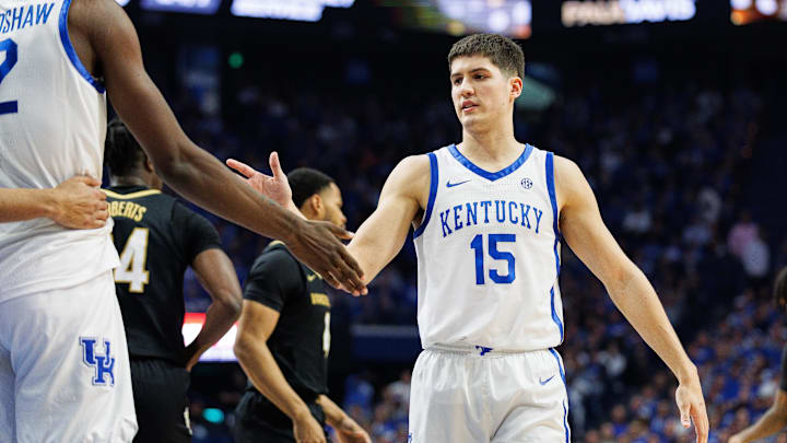 Mar 6, 2024; Lexington, Kentucky, USA; Kentucky Wildcats guard Reed Sheppard (15) fives forward Aaron Bradshaw (2) during the first half against the Vanderbilt Commodores at Rupp Arena at Central Bank Center. Mandatory Credit: Jordan Prather-USA TODAY Sports