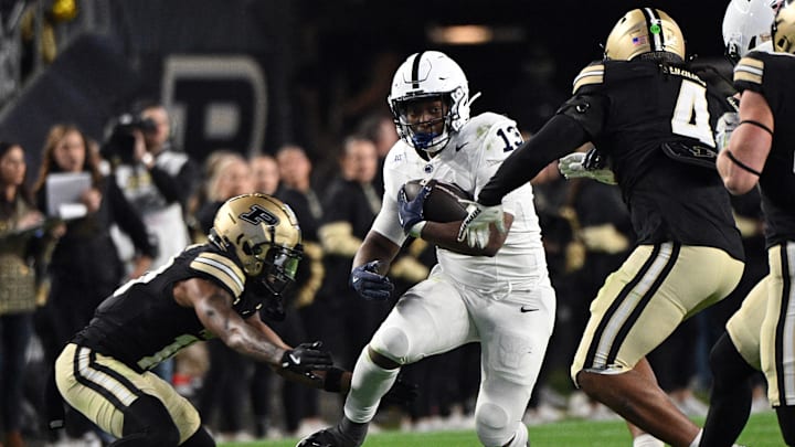 Penn State running back Kaytron Allen (13) runs into Purdue Boilermakers linebacker Kydran Jenkins (4) during the second half at Ross-Ade Stadium.