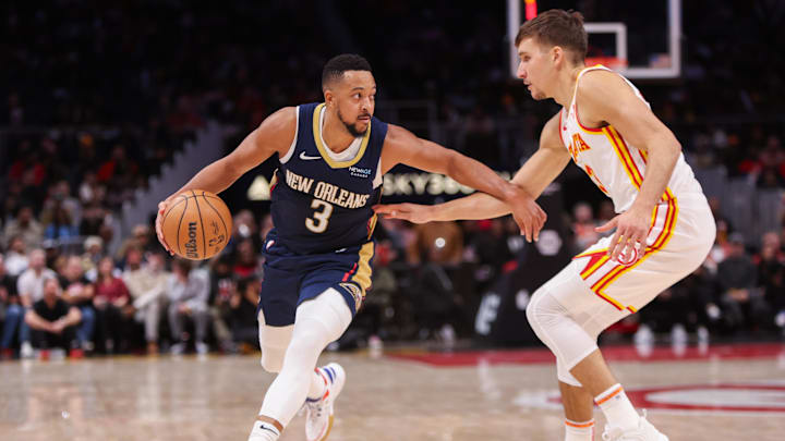 Dec 2, 2024; Atlanta, Georgia, USA; New Orleans Pelicans guard CJ McCollum (3) is defended by Atlanta Hawks guard Bogdan Bogdanovic (13) in the fourth quarter at State Farm Arena. Mandatory Credit: Brett Davis-Imagn Images Dec 2, 2024; Atlanta, Georgia, USA; New Orleans Pelicans guard CJ McCollum (3) is defended by Atlanta Hawks guard Bogdan Bogdanovic (13) in the fourth quarter at State Farm Arena. Mandatory Credit: Brett Davis-Imagn Images