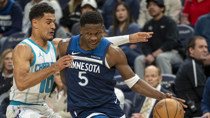 Minnesota Timberwolves guard Anthony Edwards (5) drives to the basket past Charlotte Hornets guard Josh Green in the first half at Target Center in Minneapolis on Nov. 4, 2024.