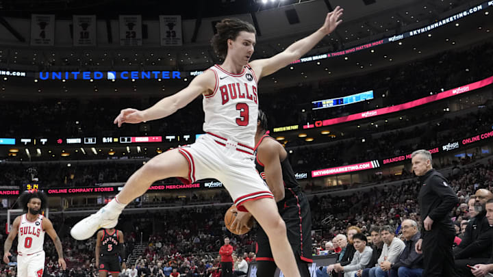 Apr 1, 2025; Chicago, Illinois, USA; Chicago Bulls guard Josh Giddey (3) defends Toronto Raptors forward Scottie Barnes (4) during the first quarter at United Center. Mandatory Credit: David Banks-Imagn Images