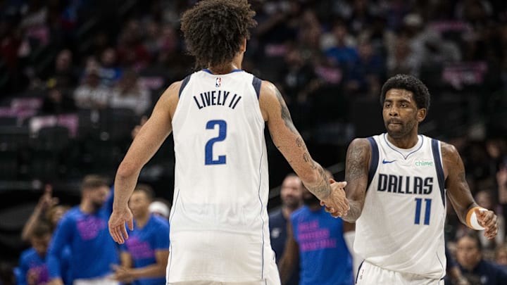 Dallas Mavericks guard Kyrie Irving (11) and center Dereck Lively.