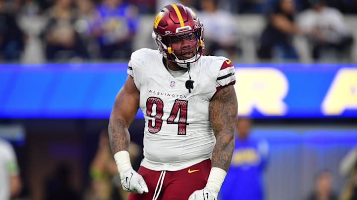 Dec 17, 2023; Inglewood, California, USA; Washington Commanders defensive tackle Daron Payne (94) reacts after sacking Los Angeles Rams quarterback Matthew Stafford (9) during the second half at SoFi Stadium. Mandatory Credit: Gary A. Vasquez-Imagn Images