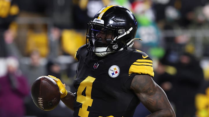 Dec 15, 2025; Pittsburgh, Pennsylvania, USA; Pittsburgh Steelers wide receiver DK Metcalf (4) scores a touchdown in the third quarter against the Miami Dolphins at Acrisure Stadium. Mandatory Credit: Charles LeClaire-Imagn Images