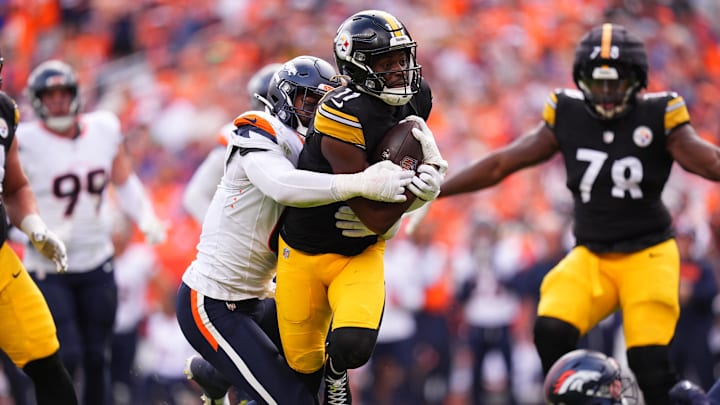 Sep 15, 2024; Denver, Colorado, USA; Pittsburgh Steelers wide receiver Van Jefferson (11) is tackled by Denver Broncos linebacker Jonathon Cooper (0) in the second quarter at Empower Field at Mile High. Mandatory Credit: Ron Chenoy-Imagn Images