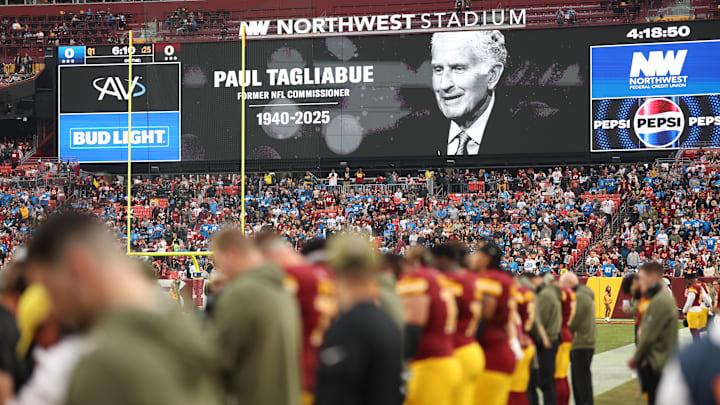 A tribute to former NFL commissioner Paul Tagliabue is seen on the video board prior to a game between the Washington Commanders and the Detroit Lions at Northwest Stadium on Sunday, Nov. 9, 2025. 