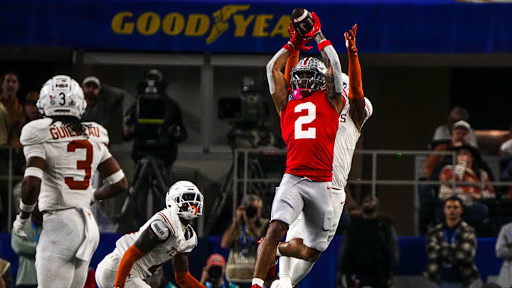 Ohio State WR Emeka Egbuka jumps for a catch during the College Football Playoff semifinal game against the Texas Longhorns.