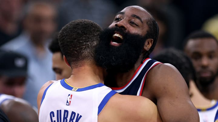 Golden State Warriors guard Stephen Curry shares an embrace with Los Angeles Clippers guard James Harden before the game between the two teams at Intuit Dome on November 18, 2024. 
