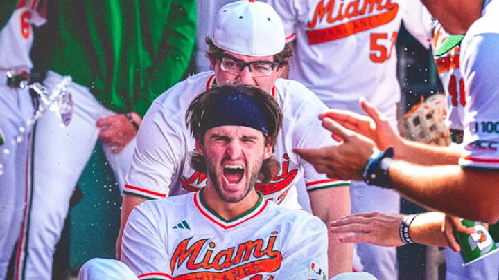 Miami Hurricanes Pitcher Griffin Hugus pushing Bobby Marsh in celebrations after Grand Slam against Princeton. 